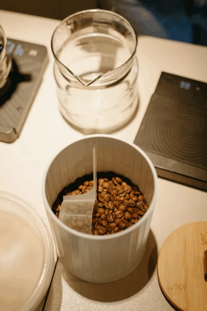 A jar of expresso beans next to a scale