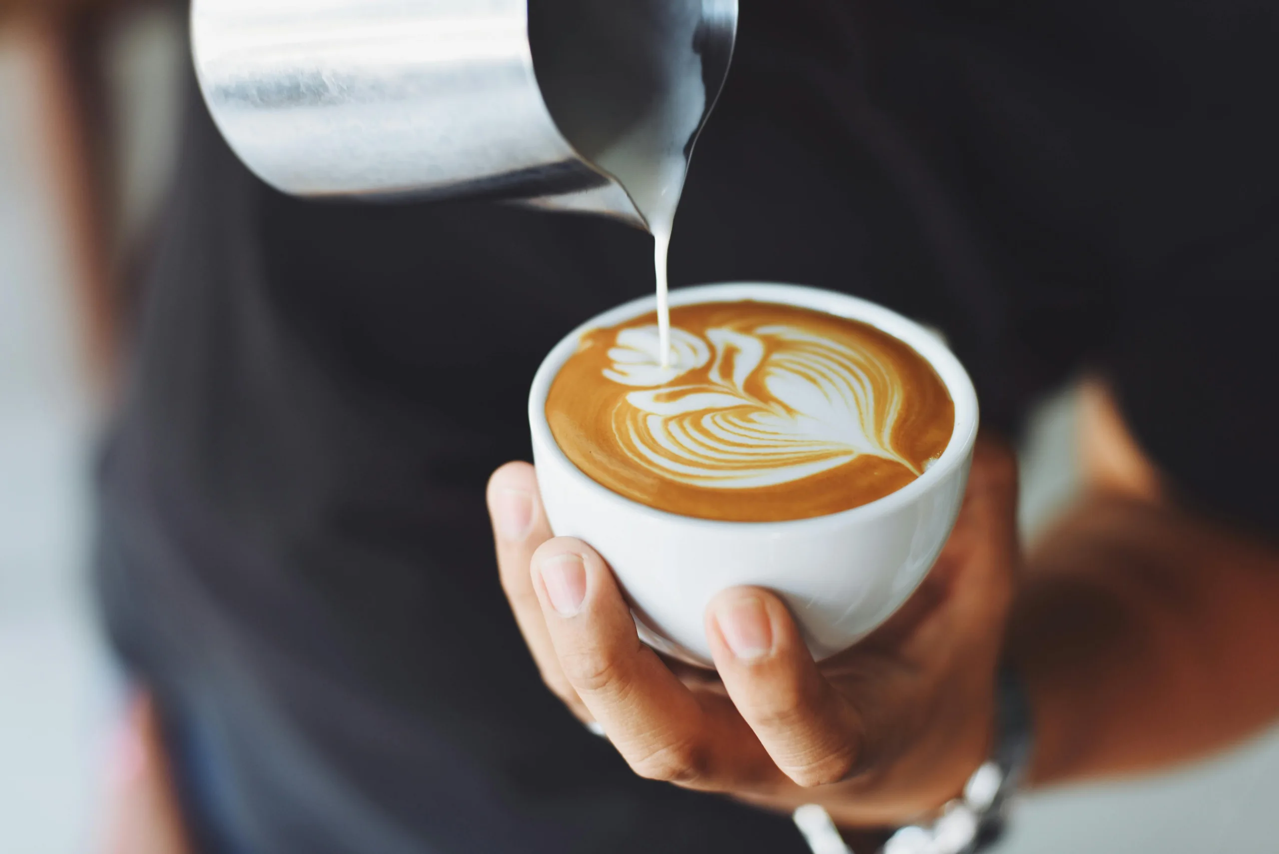 Close-up of an espresso shot pulling with rich crema from a home machine